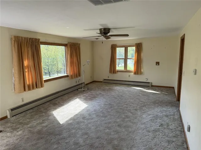 an empty room with windows