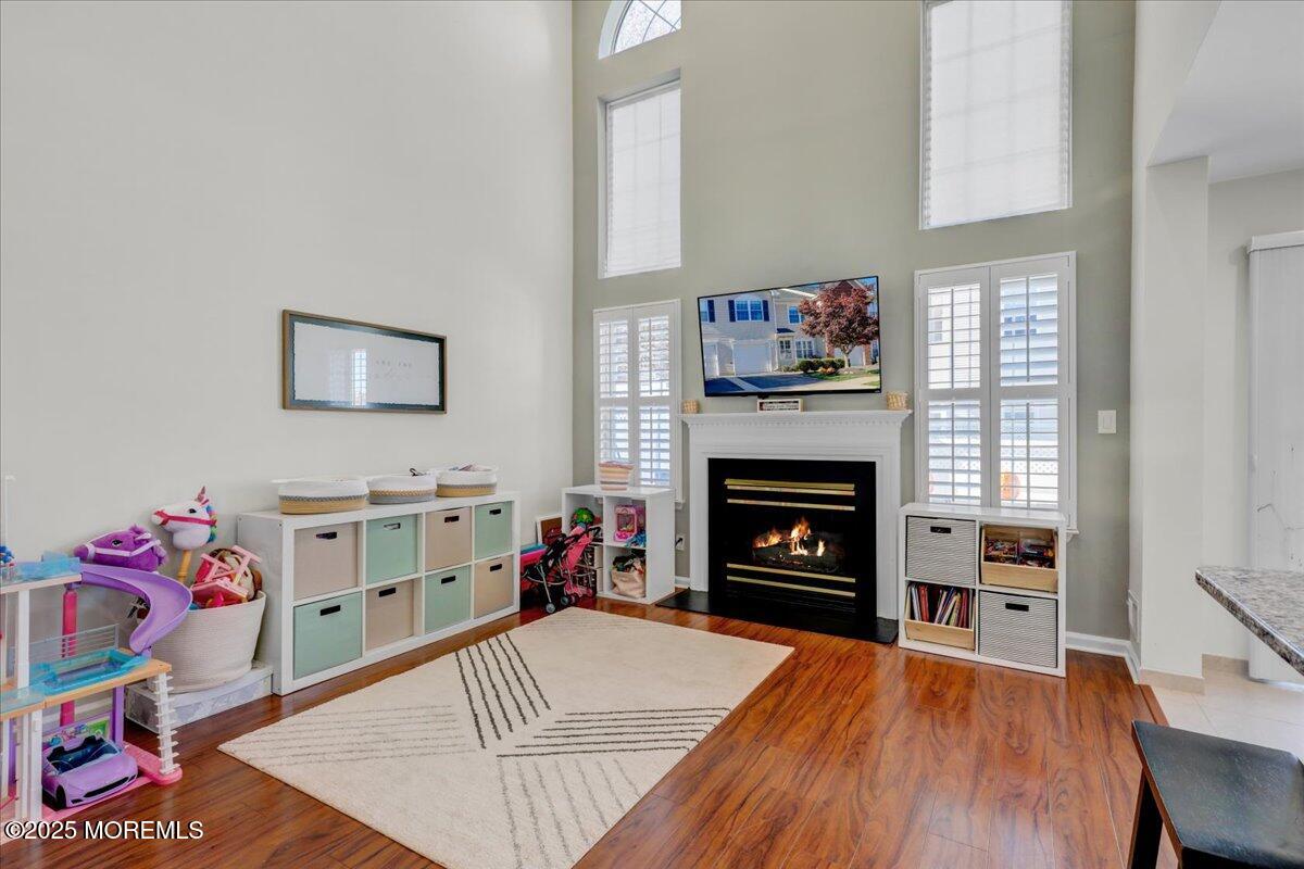 3 Ganton Way Manalapan, NJ 07726 - Photo 11 of 39 a view of a livingroom with a fireplace and workspace