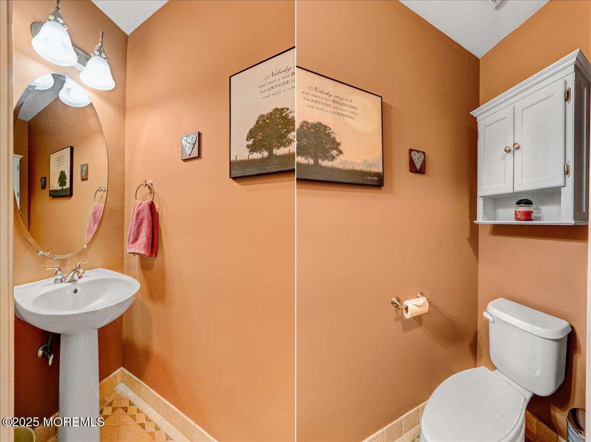 3 Ganton Way Manalapan, NJ 07726 - Photo 17 of 39 a bathroom with a toilet sink and mirror