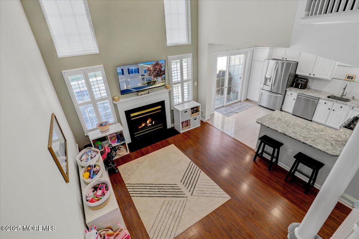 3 Ganton Way Manalapan, NJ 07726 - Photo 19 of 39 a living room with furniture and a wooden floor