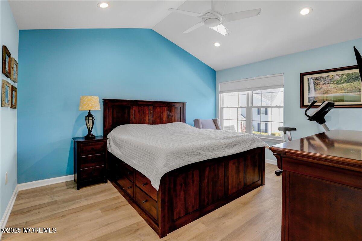 3 Ganton Way Manalapan, NJ 07726 - Photo 20 of 39 a bedroom with a bed and a flat tv screen on dresser