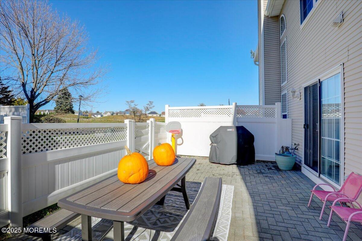 3 Ganton Way Manalapan, NJ 07726 - Photo 28 of 39 a view of a balcony with table and chairs
