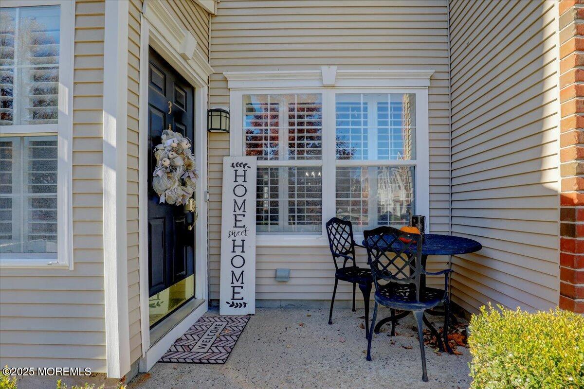 3 Ganton Way Manalapan, NJ 07726 - Photo 5 of 39 a view of a patio with table and chairs and potted plants