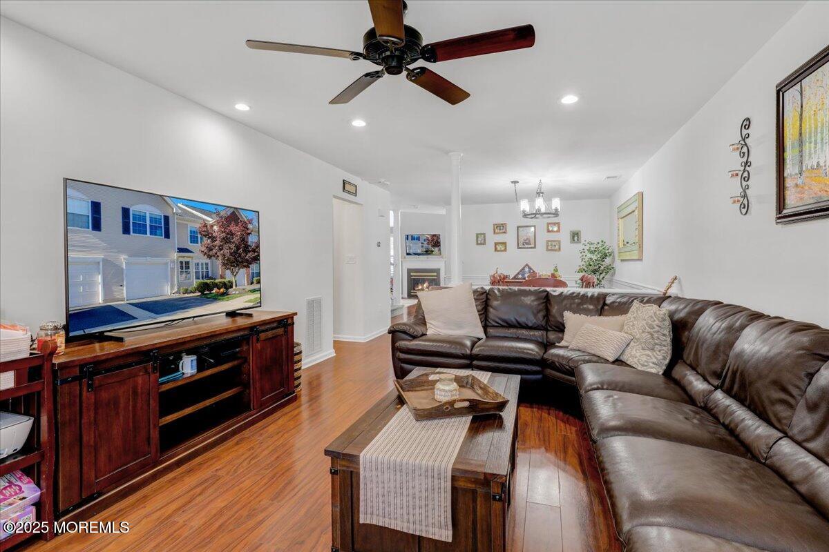 3 Ganton Way Manalapan, NJ 07726 - Photo 7 of 39 a living room with furniture and a wooden floor