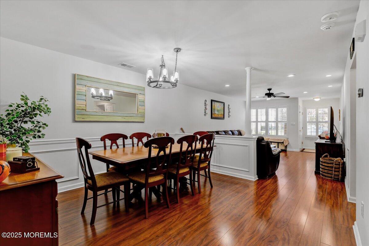 3 Ganton Way Manalapan, NJ 07726 - Photo 10 of 39 a dining room with furniture potted plants and wooden floor