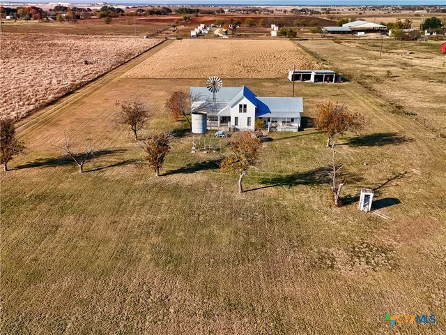 an aerial view of residential houses with outdoor space