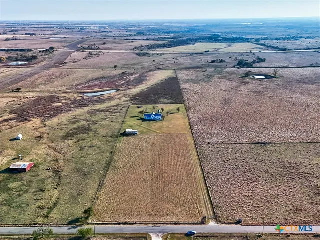 a view of a yard with an ocean