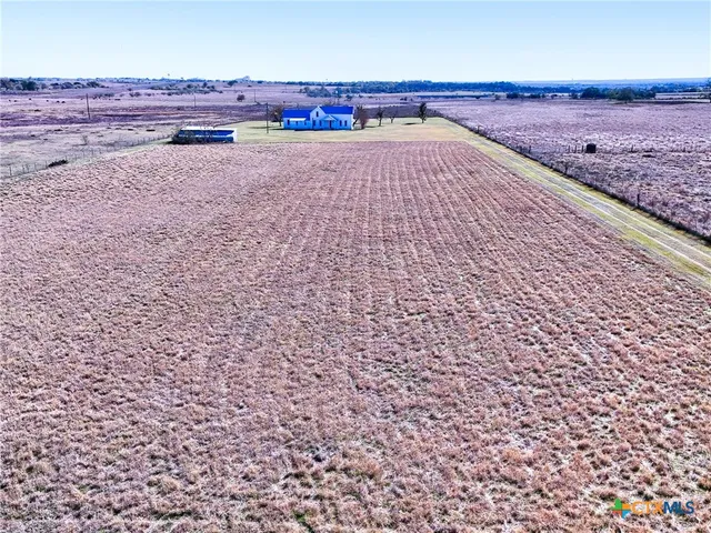 a view of a pathway with a yard