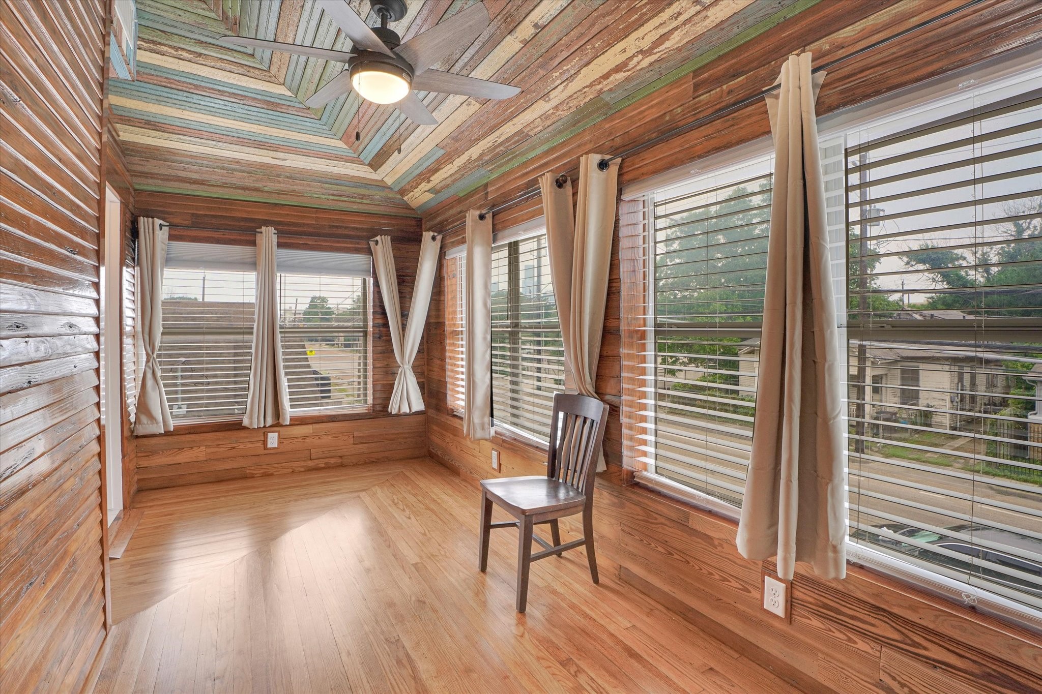 1916 Hardy Street Houston, TX 77026 - Photo 33 of 42 This area take you to the en suite full bath for bedroom #4. In this area you will find a pine "117"-siding along with some of the old bead board (ceiling) found on the exterior and interior of the house. Here we have oak floors. This space is about 7'X16'.