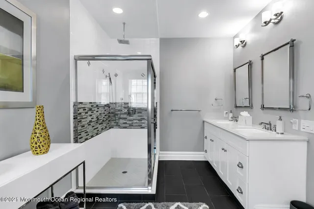 a bedroom with a bed a couch and dresser