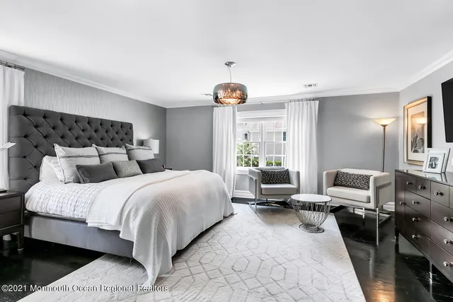 a view of a hallway with bathroom and front door