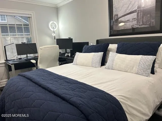 a bedroom with a bed and a potted plant