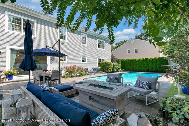 a view of swimming pool with outdoor seating