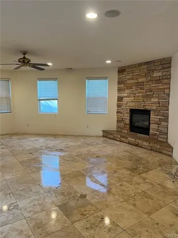 a view of a livingroom with an empty space and fire place