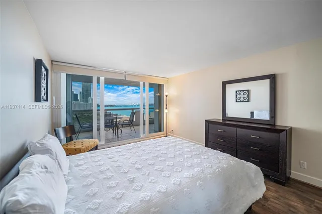 a kitchen with stainless steel appliances granite countertop a refrigerator and a stove