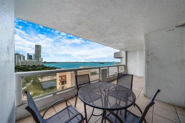 a living room with furniture and a lamp