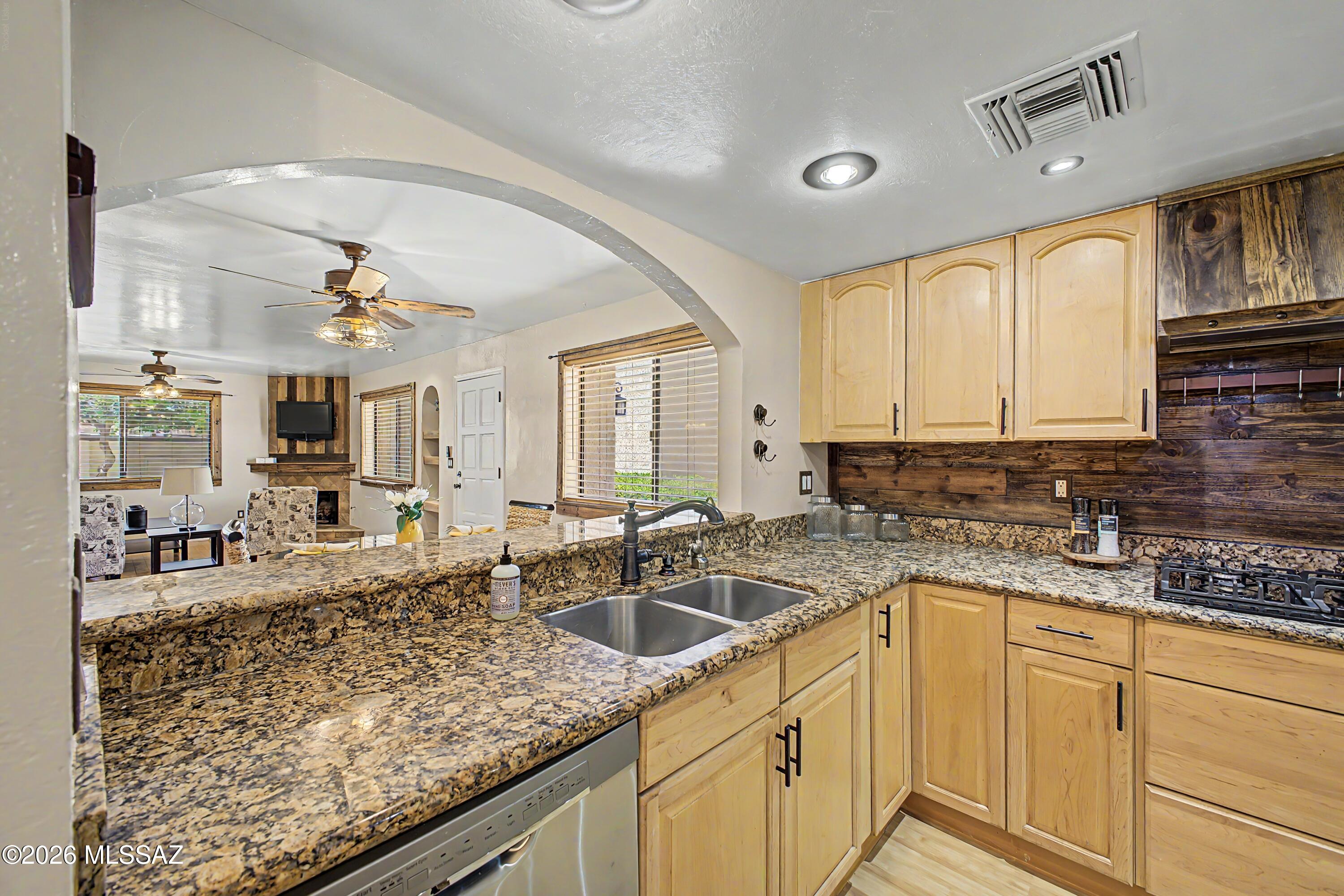 3781 East Edison Street Tucson, AZ 85716 - Photo 8 of 28 a kitchen with sink stove and cabinets