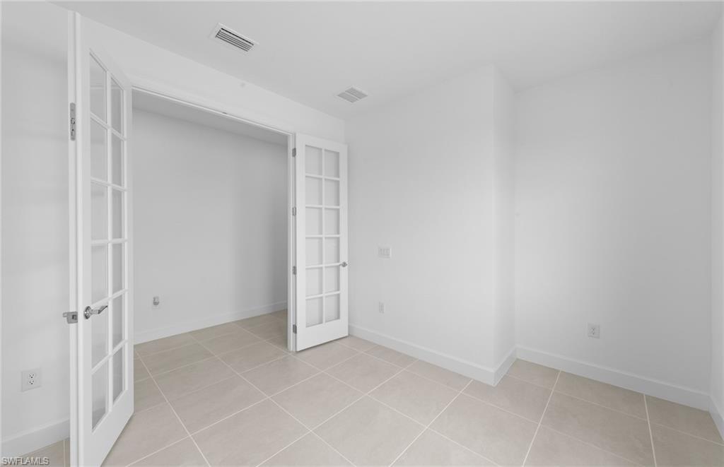 12646 Pyrite Court Alva, FL 33920 - Photo 14 of 28 an empty room with white cabinet