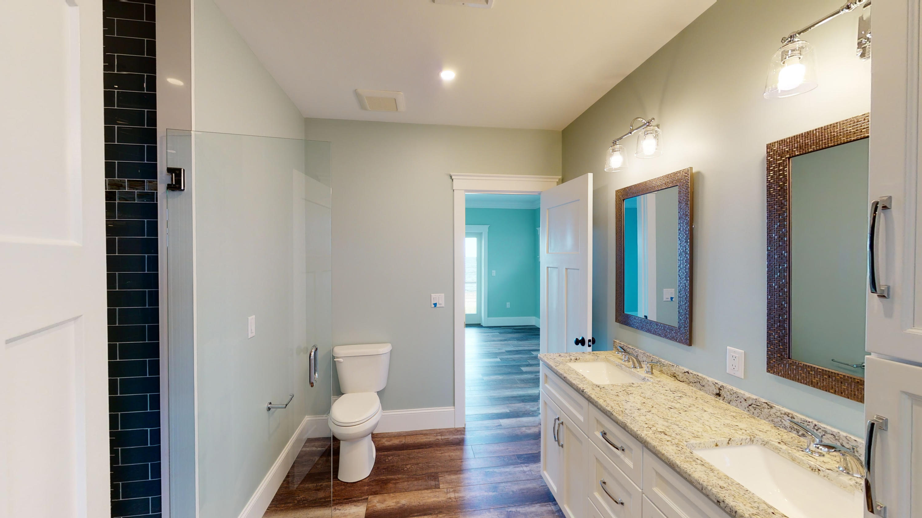 253 Phillips Road Sandwich, MA 02563 - Photo 20 of 28 a bathroom with a granite countertop sink toilet and shower