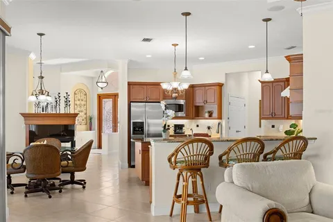 a view of a chair and tables in the back yard