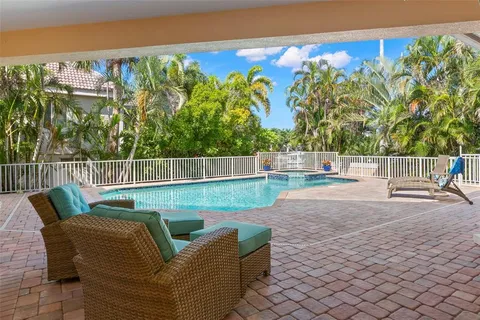 a spacious bathroom with a granite countertop sink a bathtub a mirror a vanity and a shower