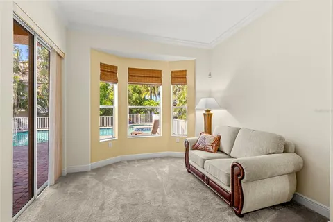 a bathroom with a granite countertop sink mirror vanity and toilet
