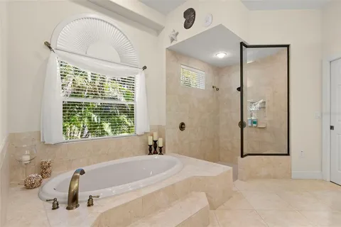 an aerial view of residential houses with outdoor space and swimming pool