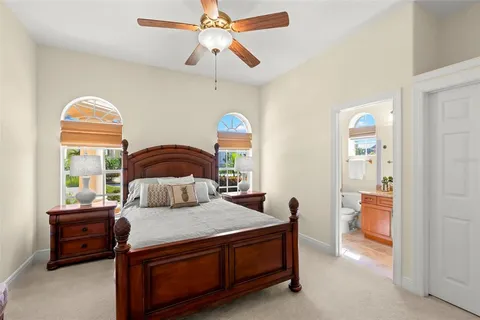 an aerial view of a house with a swimming pool patio and outdoor seating