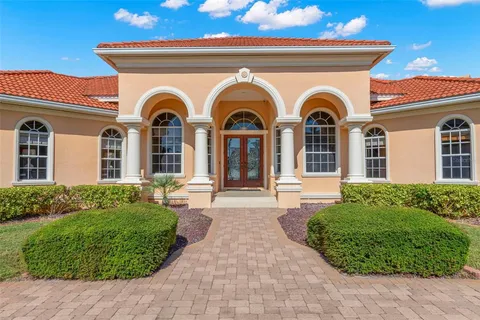 a living room with furniture a clock and a window