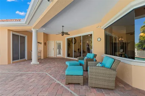 an aerial view of a house with outdoor space and lake view