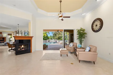 a kitchen with stainless steel appliances kitchen island granite countertop a sink a stove and a wooden floors