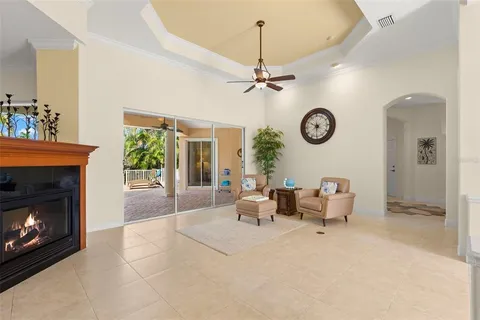 a kitchen with kitchen island granite countertop a sink counter top space appliances and cabinets