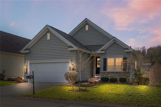 a front view of house with yard and seating area
