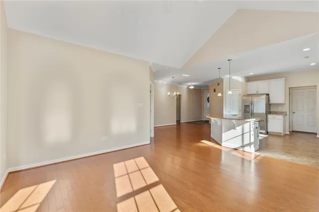 a view of a living room and kitchen with a large window