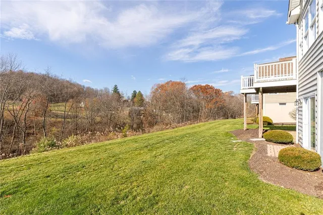 a view of a big yard with mountain