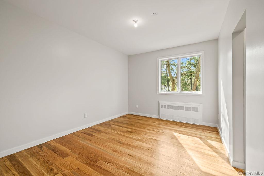 5 Mirror Lake Road, Unit 202 Spring Valley, NY 10977 - Photo 36 of 50 an empty room with a window