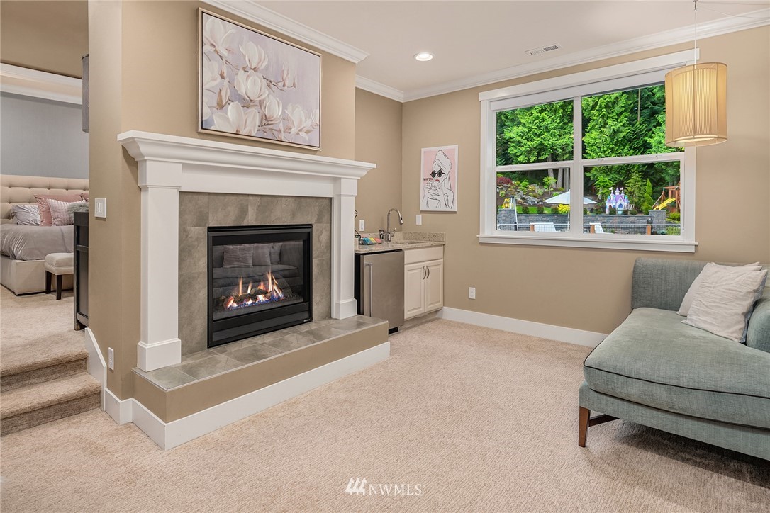 5724 197th Place Southeast Bothell, WA 98012 - Photo 17 of 40 a living room with furniture and a fireplace