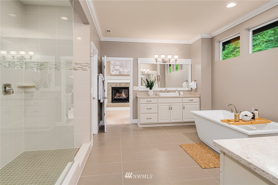 5724 197th Place Southeast Bothell, WA 98012 - Photo 18 of 40 a spacious bathroom with a double vanity sink a mirror and a shower