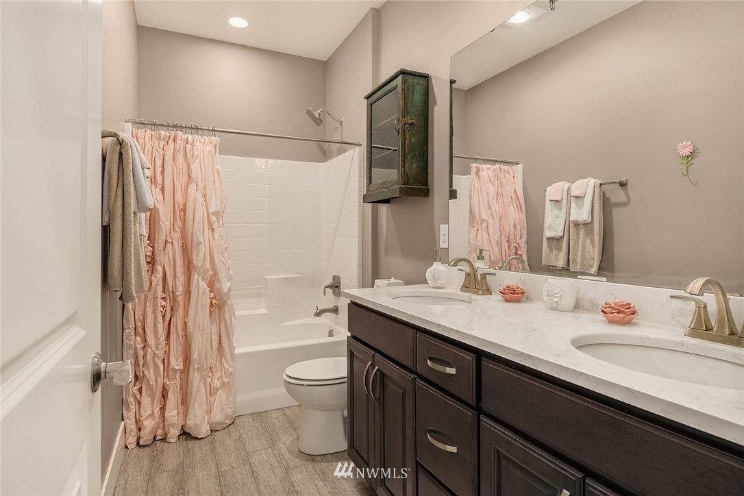 5724 197th Place Southeast Bothell, WA 98012 - Photo 26 of 40 a bathroom with a double vanity sink toilet and shower