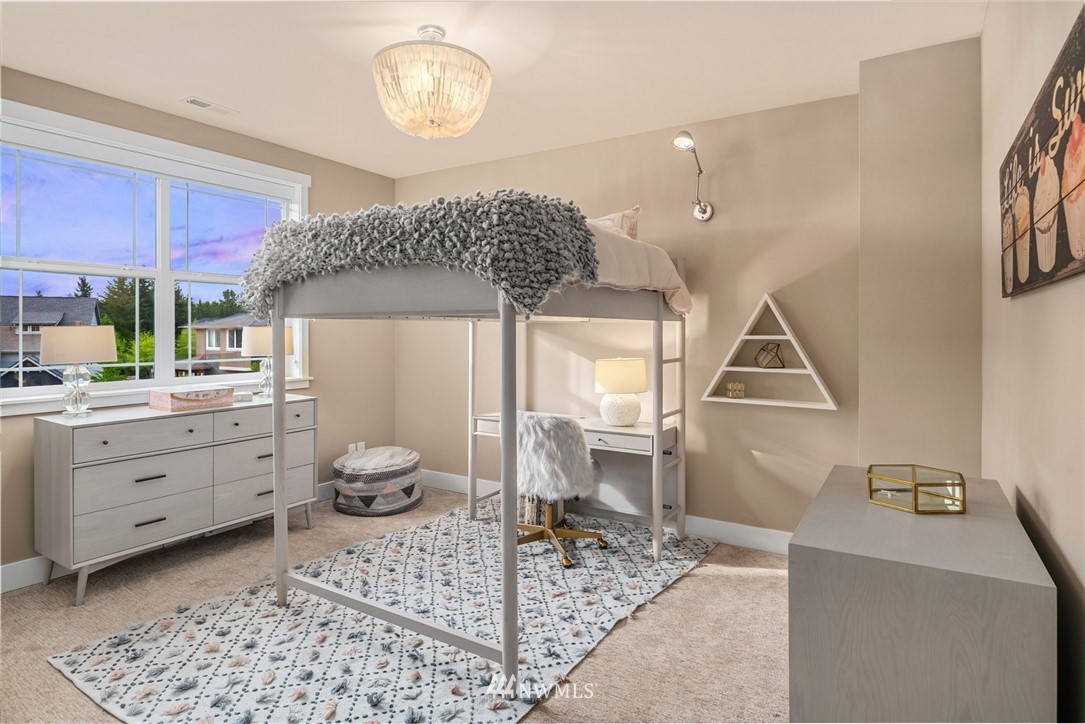 5724 197th Place Southeast Bothell, WA 98012 - Photo 28 of 40 a room with a baby crib furniture and a chandelier