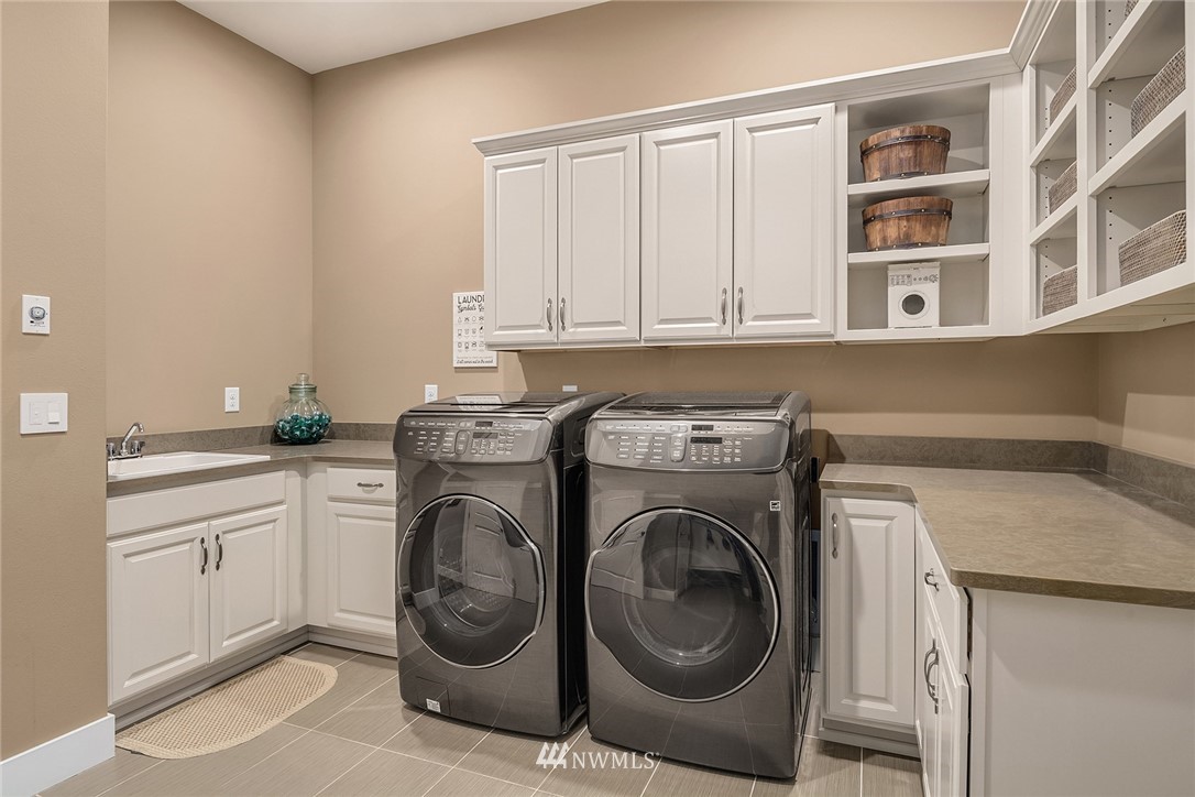 5724 197th Place Southeast Bothell, WA 98012 - Photo 29 of 40 a utility room with sink dryer and washer