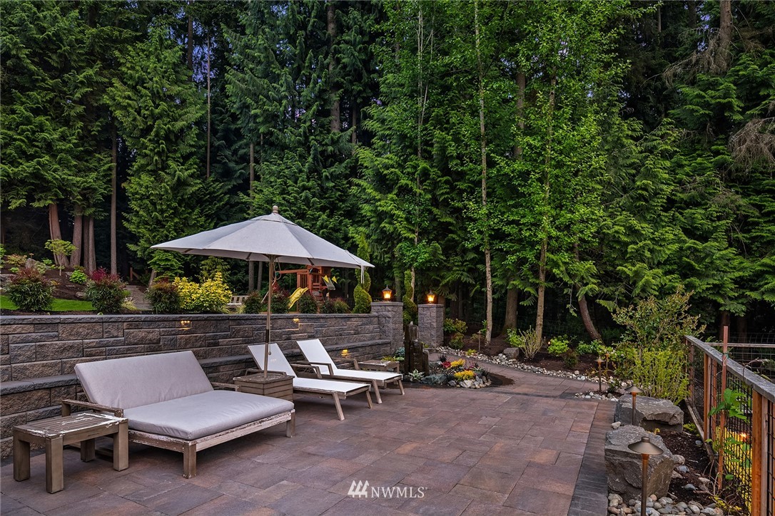 5724 197th Place Southeast Bothell, WA 98012 - Photo 35 of 40 a view of backyard with outdoor seating and trees