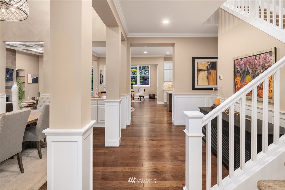 5724 197th Place Southeast Bothell, WA 98012 - Photo 6 of 40 a view of a hallway with wooden floor and dining room