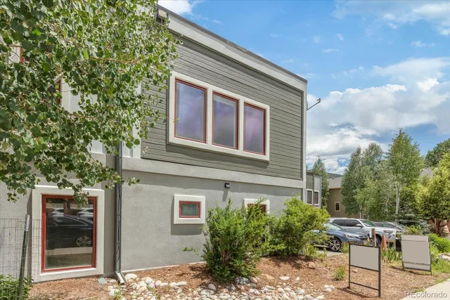 a kitchen with stainless steel appliances granite countertop a refrigerator a stove and a sink