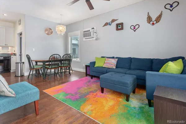 a living room with furniture and a rug