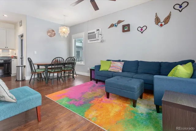 a living room with furniture and a rug