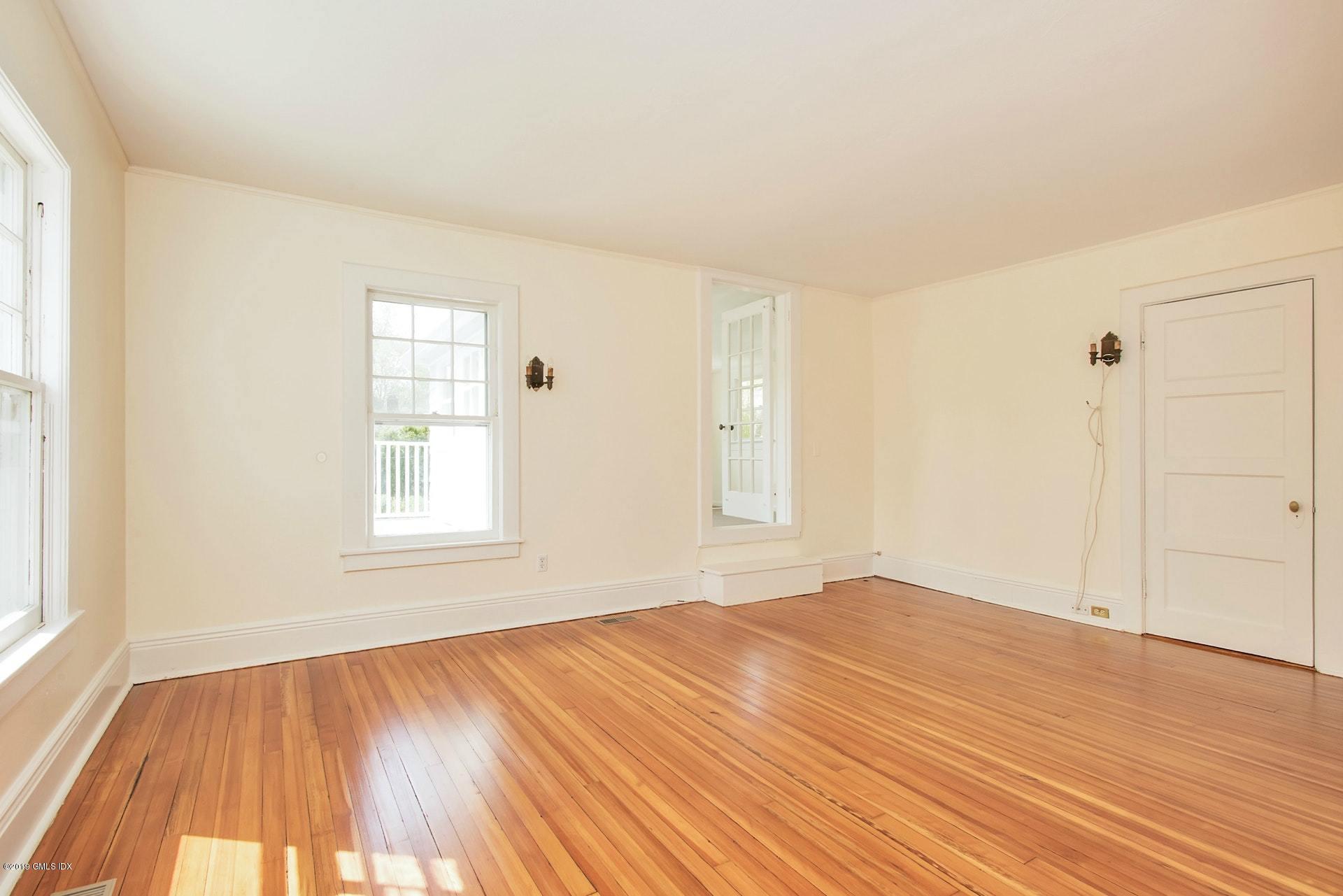 17 Ballwood Road Old Greenwich, CT 06870 - Photo 14 of 36 an empty room with wooden floor and windows