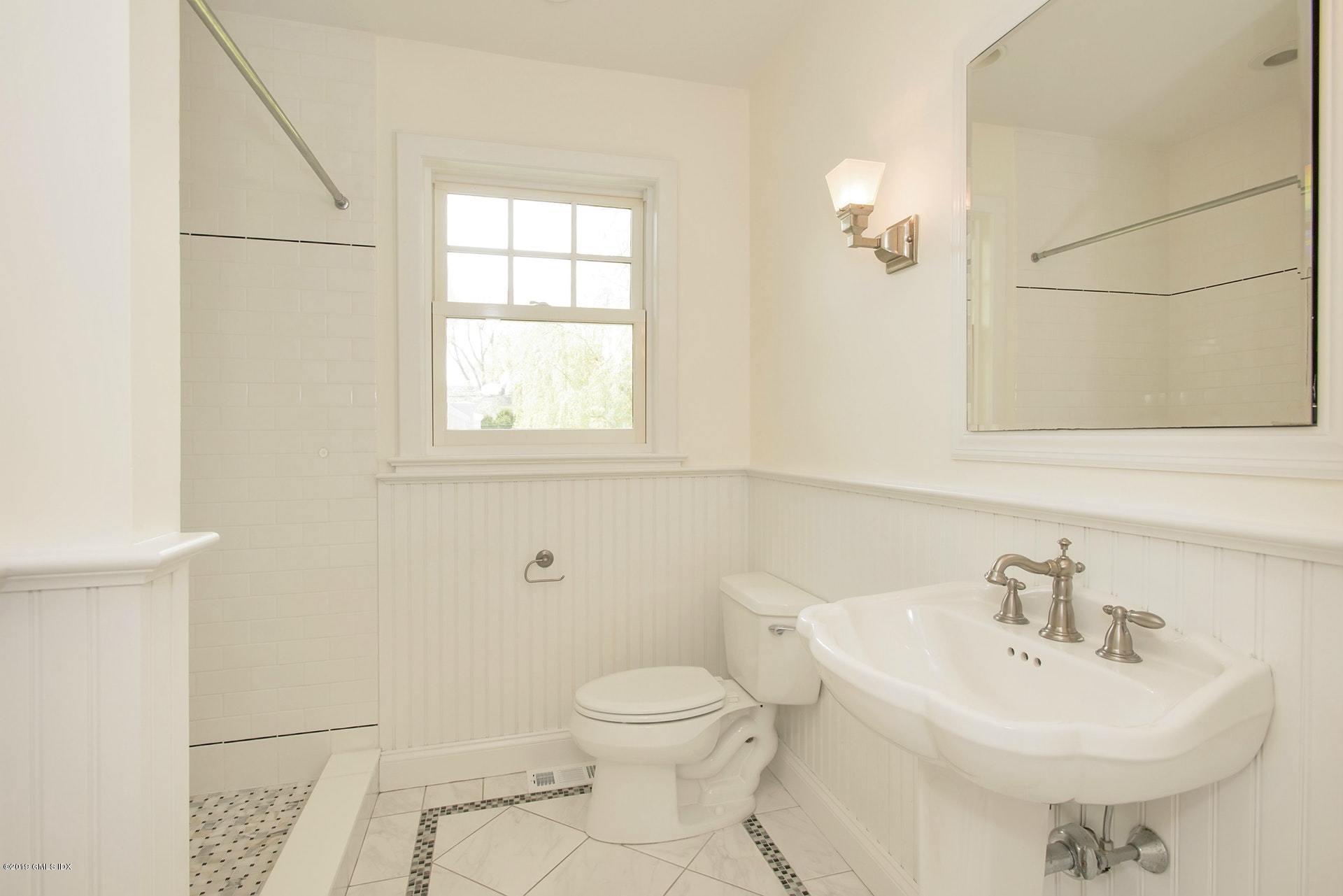 17 Ballwood Road Old Greenwich, CT 06870 - Photo 18 of 36 a bathroom with a sink toilet and a mirror