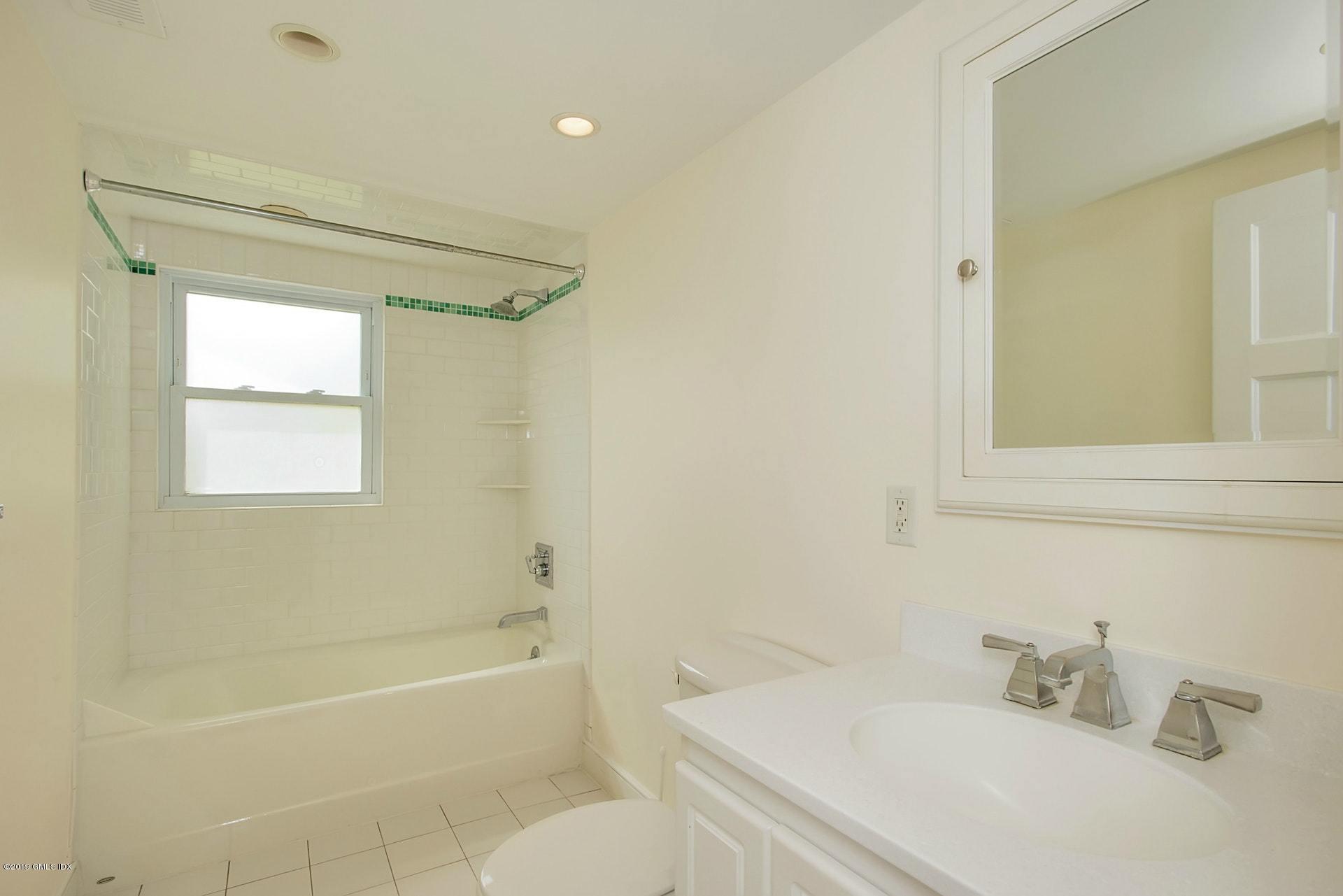 17 Ballwood Road Old Greenwich, CT 06870 - Photo 19 of 36 a bathroom with a sink a toilet and shower