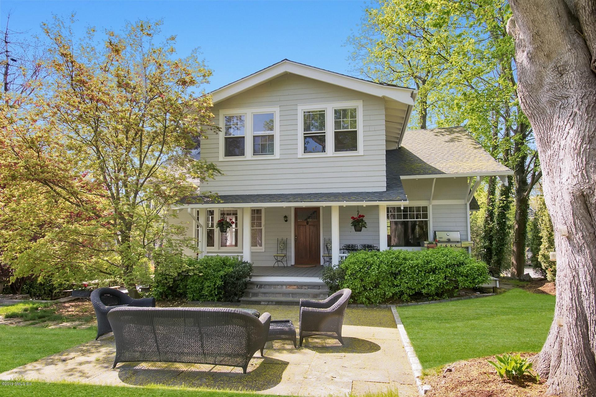 17 Ballwood Road Old Greenwich, CT 06870 - Photo 2 of 36 a front view of a house with a yard